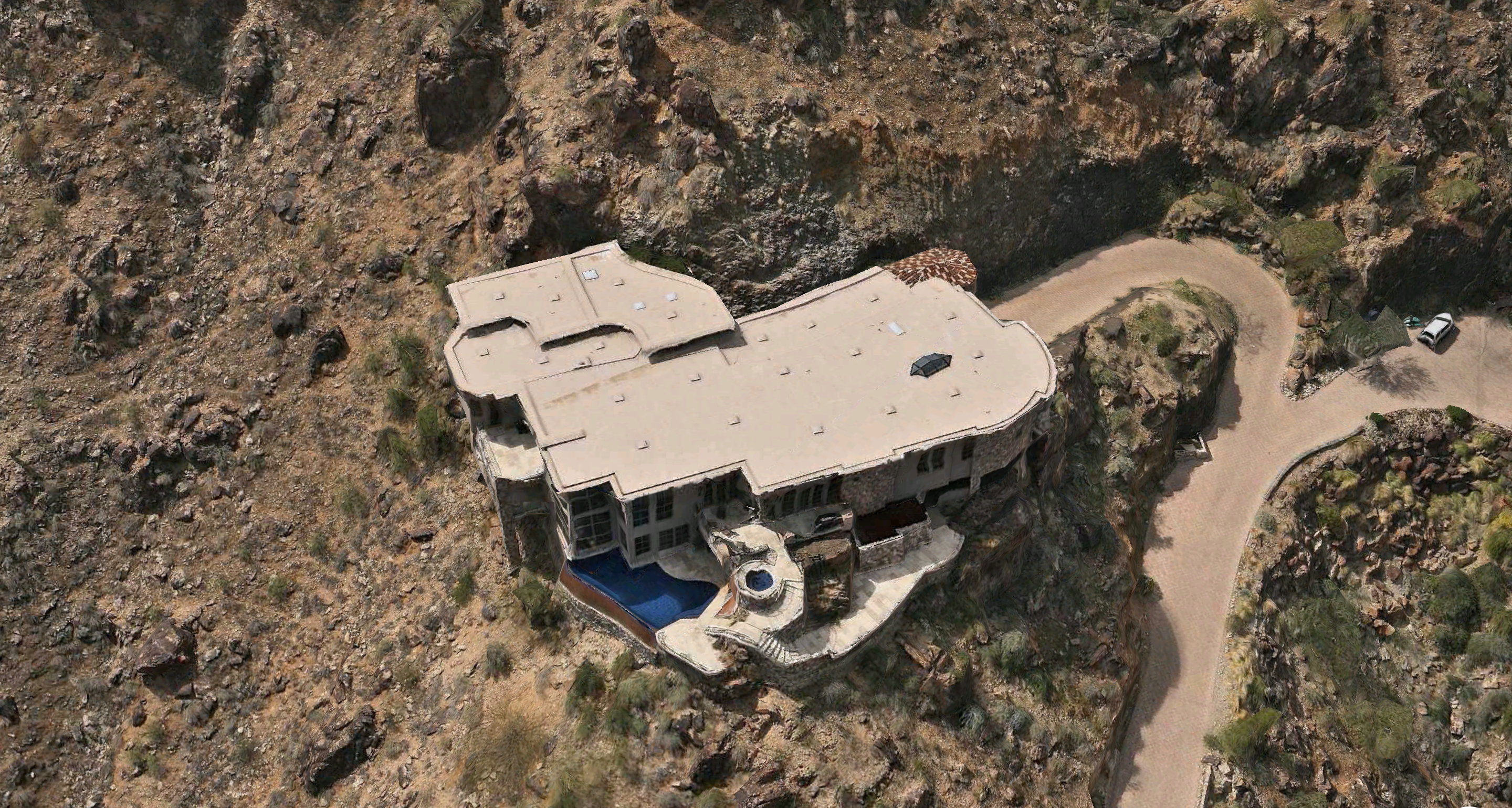 Roofing Paradise Valley Mountainside Mansion with tile, foam and coating roof.